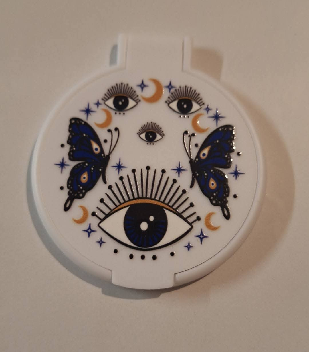 Eye with butterflies pocket mirror